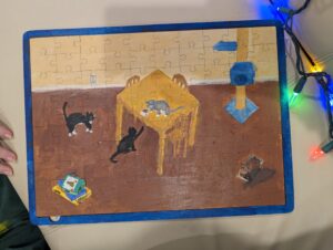 hand-painted wooden puzzle with cats